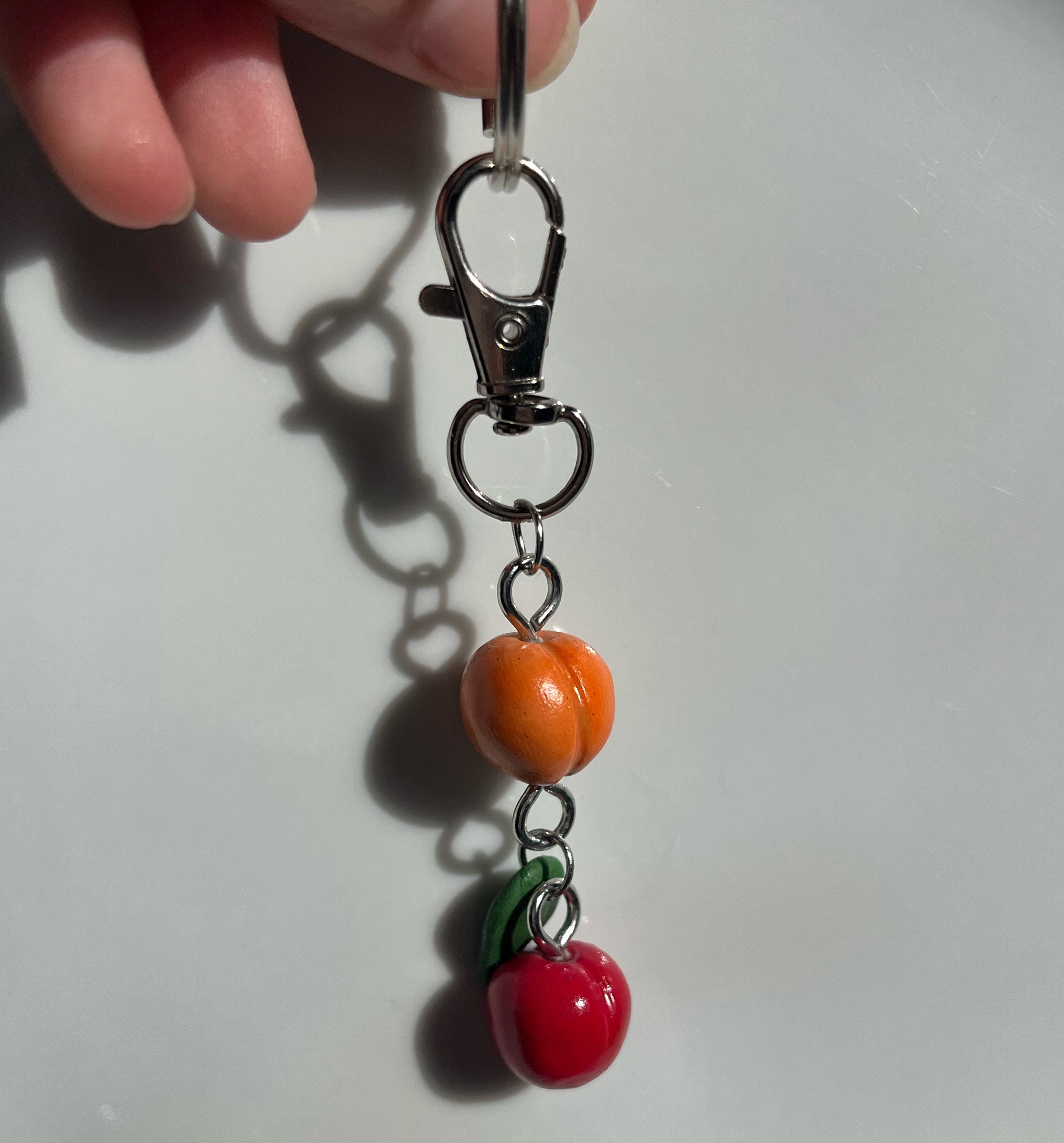 Porte-clés pêche et pomme